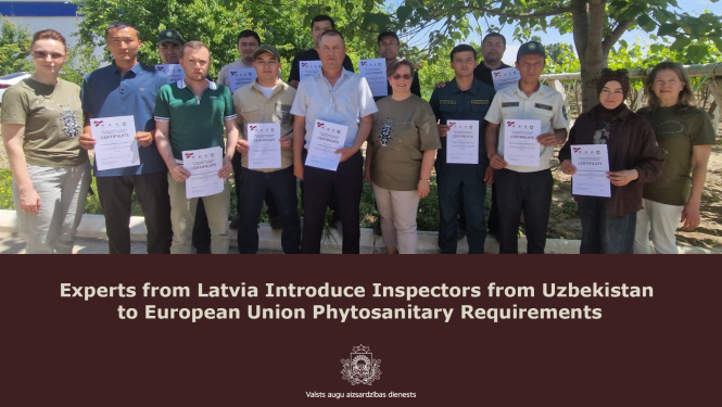 Latvian experts present training certificates to Uzbek inspectors.